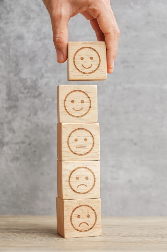 emotion face symbol on wooden blocks. mood, Service rating, ranking, customer review, satisfaction
